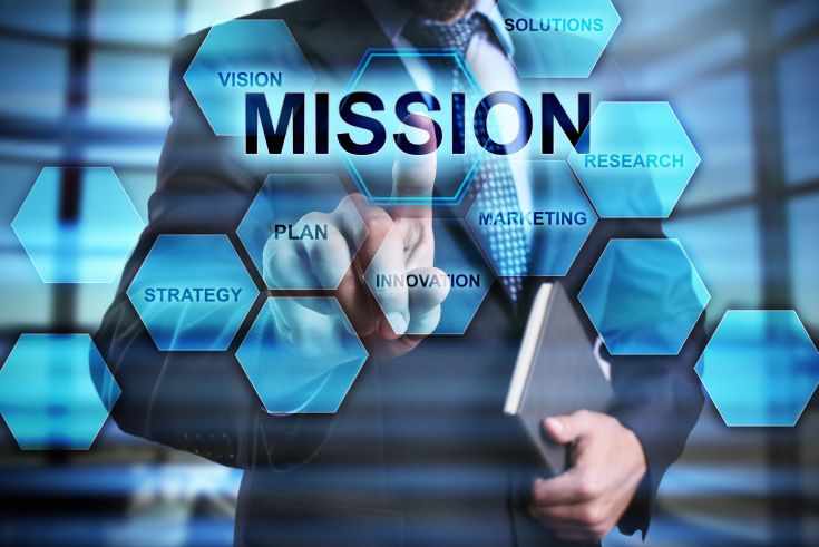 Businessman is pressing on the virtual screen and selecting “Mission”. Businessman is pressing on the virtual screen and selecting "Mission".