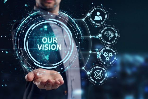 Business, Technology, Internet and network concept. Young businessman working on a virtual screen of the future and sees the inscription: Our vision